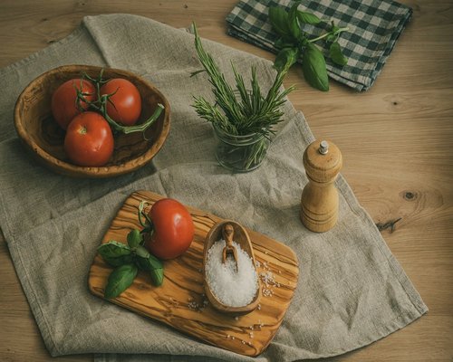 Fresh ingredients stored neatly in clear containers on a table