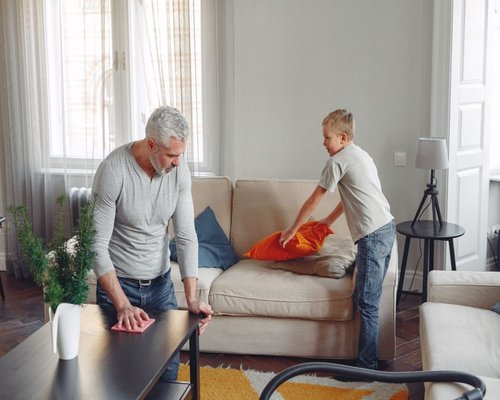 Family relaxing in a tidy and clean living room setting